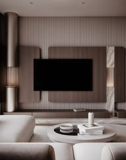 Bespoke media lounge with fluted timber, marble and curved seating